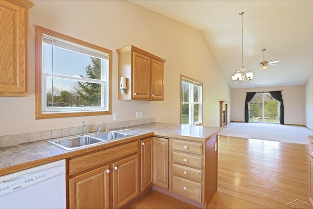 1 Sanctuary Way, Freeland, MI 48623 - kitchen featuring dishwasher, a sink, open floor plan, vaulted ceiling, and a peninsula