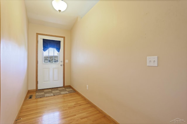 1 Sanctuary Way, Freeland, MI 48623 - doorway featuring light wood-type flooring and baseboards