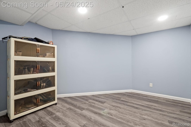 508 Chamberlain St Unit 8, Flushing, MI 48433 - finished basement featuring wood finished floors, a drop ceiling, and baseboards