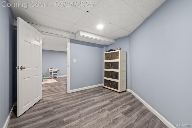 508 Chamberlain St Unit 8, Flushing, MI 48433 - finished below grade area with wood finished floors, baseboards, and a paneled ceiling