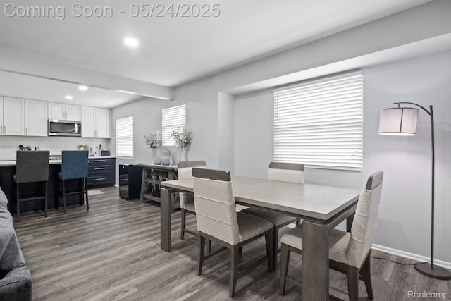 508 Chamberlain St Unit 8, Flushing, MI 48433 - dining area with dark wood-type flooring, recessed lighting, and baseboards