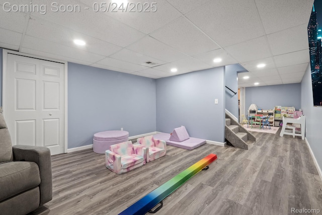 508 Chamberlain St Unit 8, Flushing, MI 48433 - playroom featuring baseboards, wood finished floors, a drop ceiling, and recessed lighting