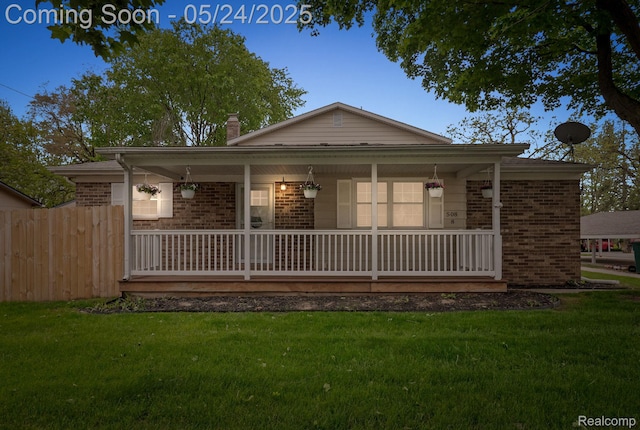 508 Chamberlain St Unit 8, Flushing, MI 48433 - view of front of property with brick siding and a porch
