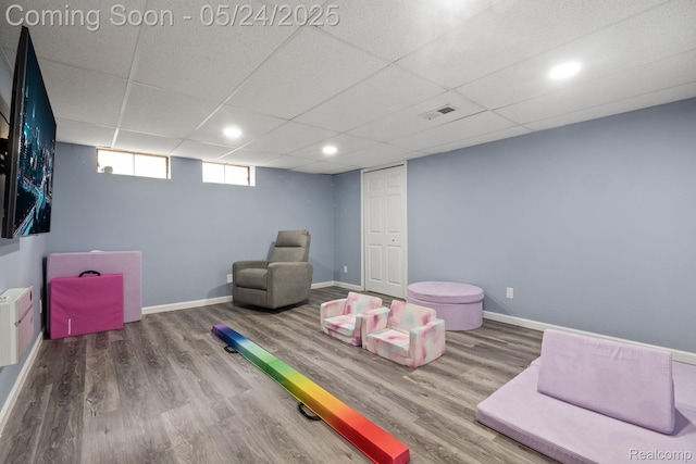 508 Chamberlain St Unit 8, Flushing, MI 48433 - rec room with wood finished floors, baseboards, recessed lighting, and a paneled ceiling