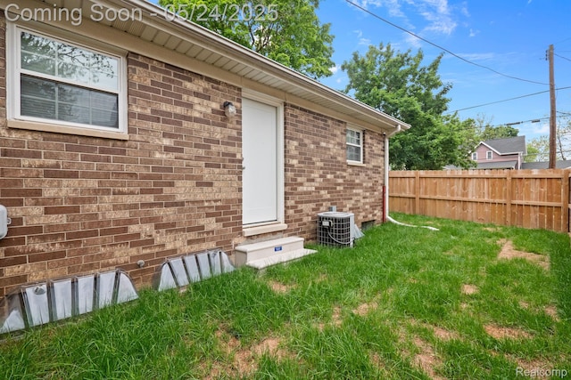 508 Chamberlain St Unit 8, Flushing, MI 48433 - view of home's exterior featuring central air condition unit and brick siding