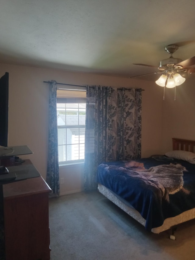 bedroom featuring carpet floors and a ceiling fan