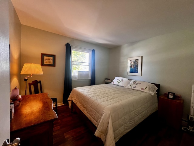 304 S Ferry St Unit 7, Ludington, MI 49431 - bedroom featuring dark wood finished floors and baseboards