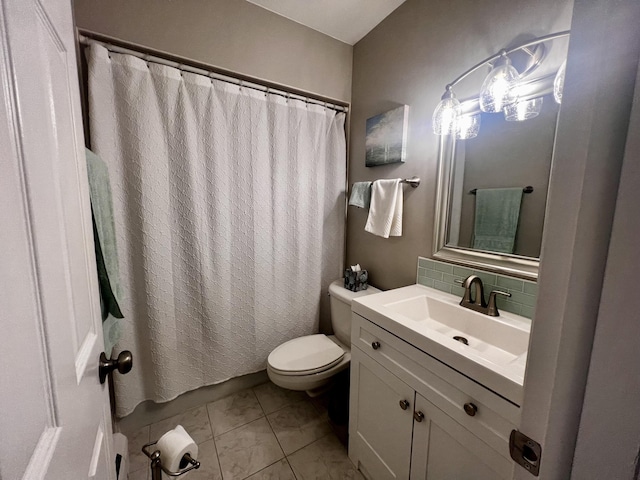 304 S Ferry St Unit 7, Ludington, MI 49431 - bathroom featuring toilet, tasteful backsplash, vanity, and curtained shower