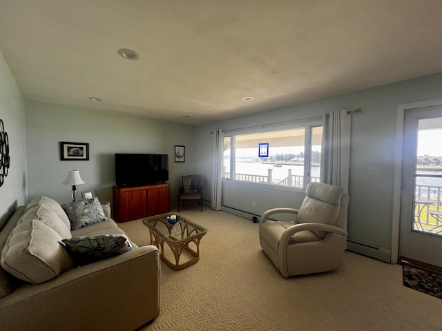 304 S Ferry St Unit 7, Ludington, MI 49431 - living area featuring light colored carpet, recessed lighting, and a baseboard heating unit