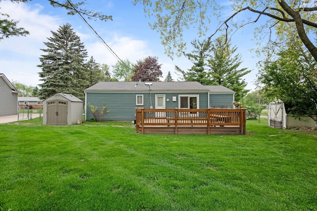 1837 Henbert Rd, West Bloomfield, MI 48324 - back of property with a shed, an outdoor structure, a wooden deck, and a lawn