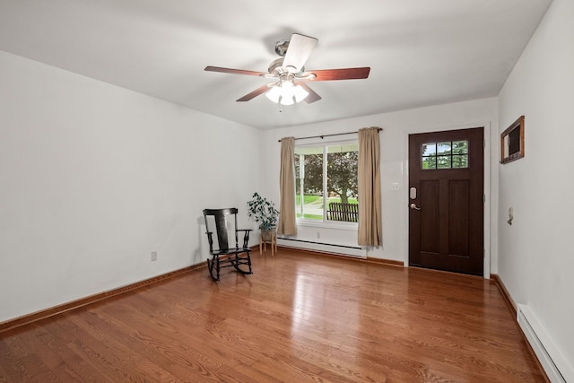 1837 Henbert Rd, West Bloomfield, MI 48324 - foyer entrance featuring baseboard heating, wood finished floors, ceiling fan, and baseboards
