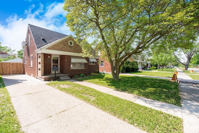 1526 S Gulley Rd, Dearborn Heights, MI 48125 - bungalow-style home with brick siding, concrete driveway, and a shingled roof