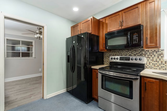 1526 S Gulley Rd, Dearborn Heights, MI 48125 - kitchen featuring black appliances, brown cabinetry, decorative backsplash, a ceiling fan, and recessed lighting