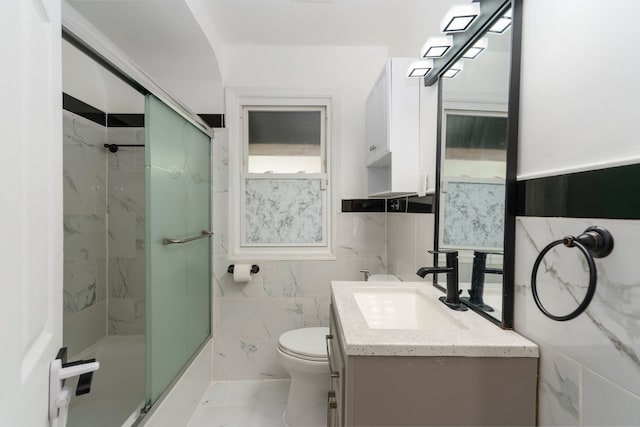 1526 S Gulley Rd, Dearborn Heights, MI 48125 - bathroom featuring tile walls, vanity, toilet, and wainscoting