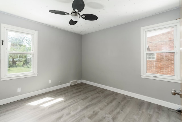 1526 S Gulley Rd, Dearborn Heights, MI 48125 - unfurnished room with light wood-style flooring, ceiling fan, baseboards, and ornamental molding