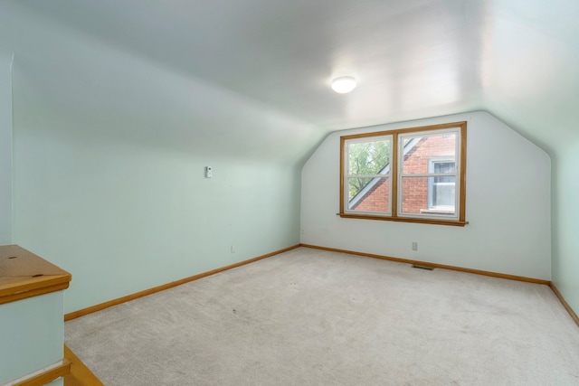 1526 S Gulley Rd, Dearborn Heights, MI 48125 - bonus room featuring baseboards, light colored carpet, and vaulted ceiling