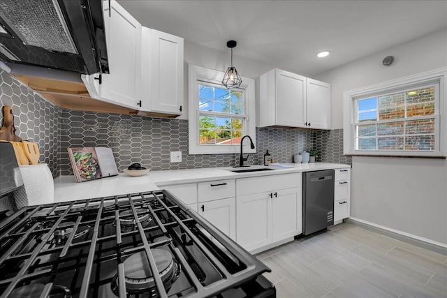17550 Ohio St, Detroit, MI 48221 - kitchen with stainless steel dishwasher, a sink, healthy amount of natural light, light countertops, and recessed lighting