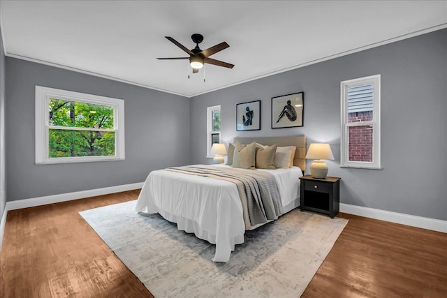 17550 Ohio St, Detroit, MI 48221 - bedroom with baseboards, crown molding, wood finished floors, and a ceiling fan