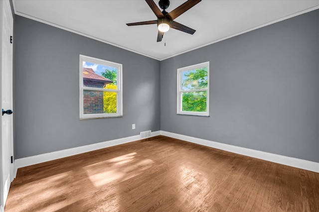 17550 Ohio St, Detroit, MI 48221 - spare room with ceiling fan, plenty of natural light, crown molding, baseboards, and wood finished floors