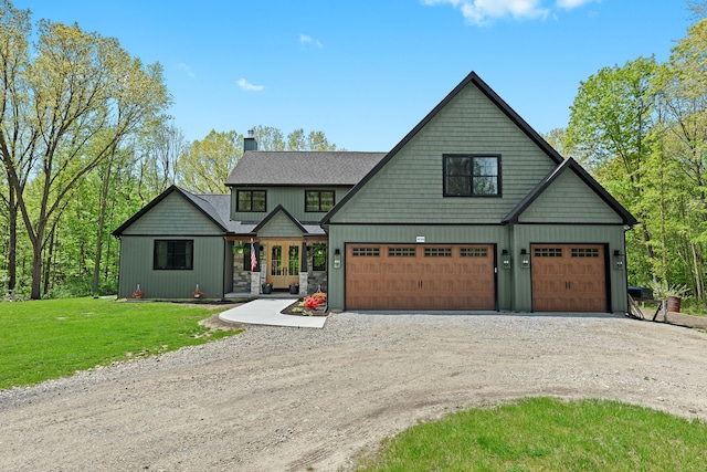 view of front of property featuring dirt driveway, a chimney, a front lawn, a garage, and board and batten siding