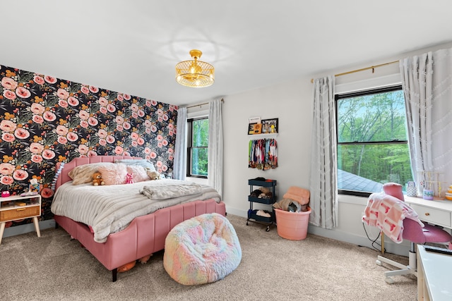 carpeted bedroom featuring baseboards