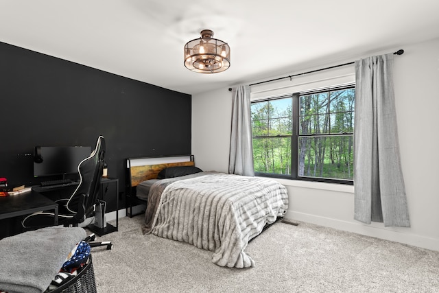 carpeted bedroom with baseboards