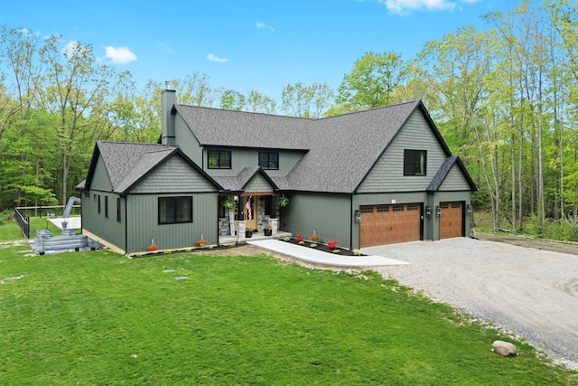 view of front of property with driveway, a front lawn, a porch, a chimney, and a shingled roof