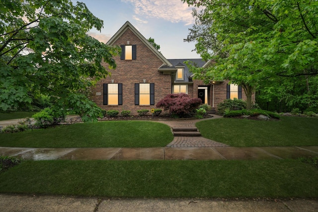 42259 White Hart Blvd, Canton, MI 48188 - traditional-style house with brick siding and a front yard