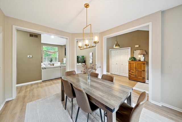 42259 White Hart Blvd, Canton, MI 48188 - dining room featuring light wood-style floors, baseboards, and a chandelier