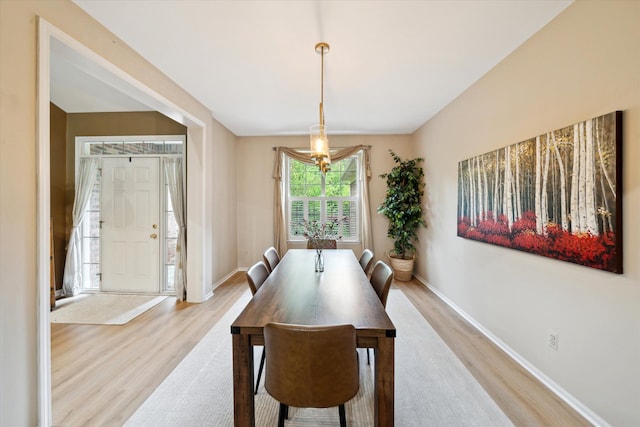 42259 White Hart Blvd, Canton, MI 48188 - dining area featuring light wood finished floors, a chandelier, and baseboards