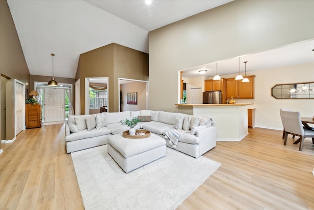 42259 White Hart Blvd, Canton, MI 48188 - living area featuring high vaulted ceiling, light wood-type flooring, baseboards, and a chandelier