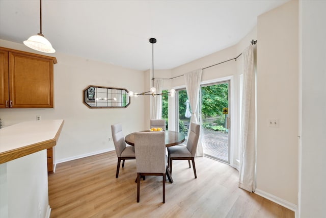 42259 White Hart Blvd, Canton, MI 48188 - dining area with light wood-style floors, baseboards, and a chandelier