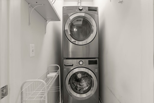 laundry room featuring stacked washer / dryer