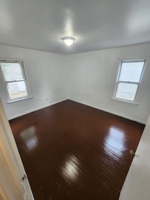 8428 Rosemont Ave, Detroit, MI 48228 - empty room featuring dark wood-style floors and baseboards