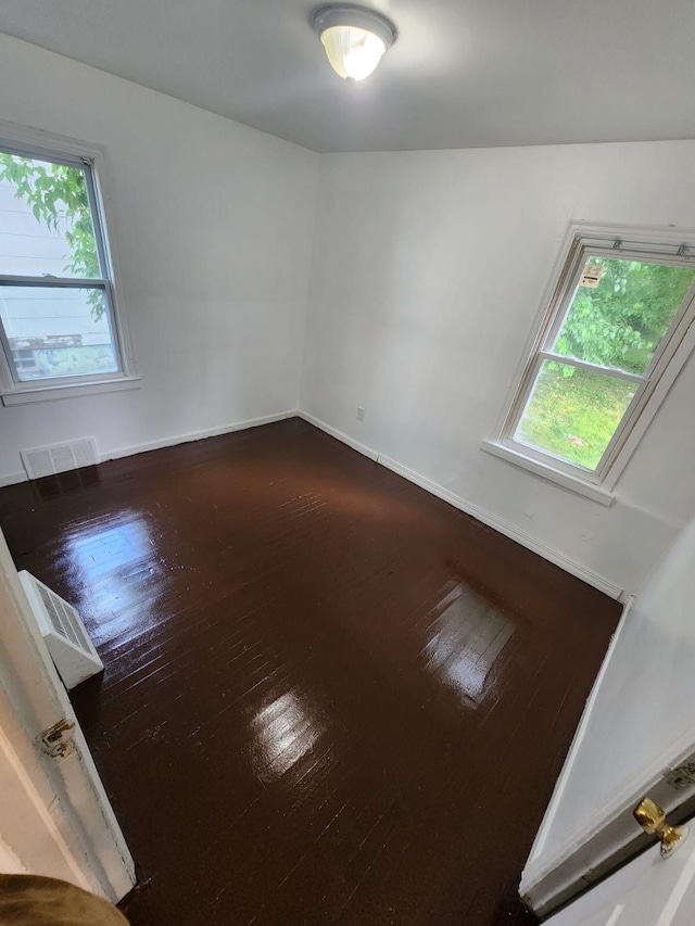 8428 Rosemont Ave, Detroit, MI 48228 - spare room with dark wood-style flooring and baseboards