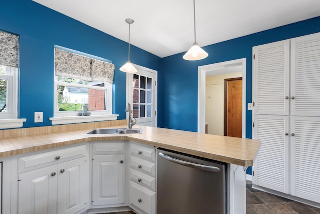 212 W Mckay St, Saline, MI 48176 - kitchen with dishwasher, a sink, white cabinetry, wood counters, and decorative light fixtures