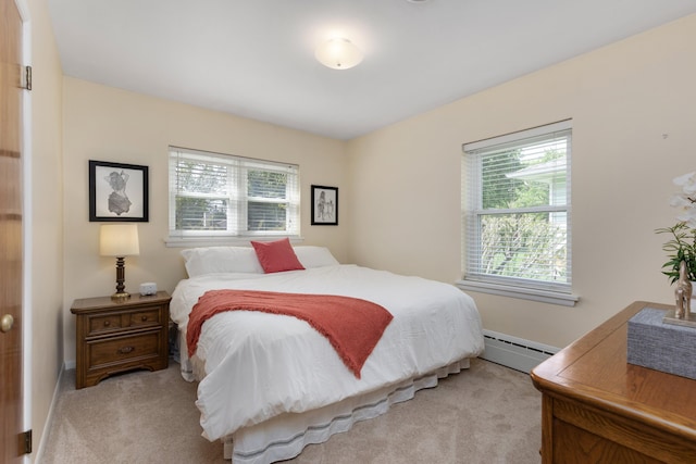 212 W Mckay St, Saline, MI 48176 - bedroom with baseboard heating, light carpet, and baseboards