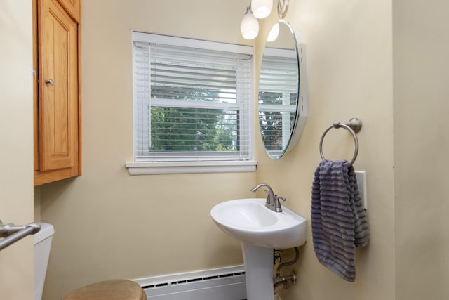 212 W Mckay St, Saline, MI 48176 - half bathroom with a baseboard heating unit and toilet