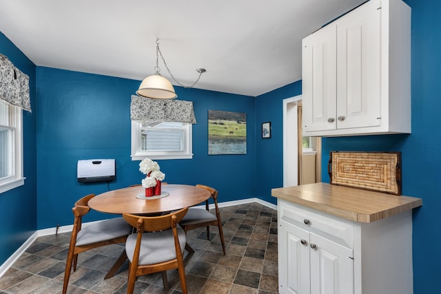212 W Mckay St, Saline, MI 48176 - dining room featuring stone finish floors and baseboards