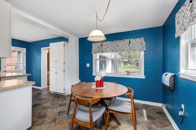 212 W Mckay St, Saline, MI 48176 - dining area featuring stone finish flooring and baseboards