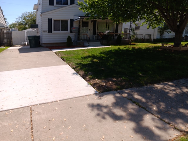 2209 Progress Ave, Lincoln Park, MI 48146 - view of front of home with covered porch and driveway