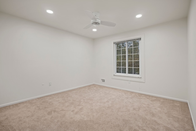 spare room featuring carpet floors, baseboards, recessed lighting, and ceiling fan