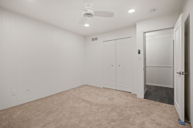 unfurnished bedroom featuring carpet floors, ceiling fan, recessed lighting, and a closet