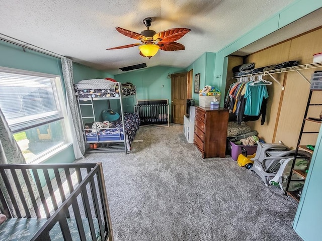 411 S Grover Ave, Alma, MI 48801 - carpeted bedroom with a closet, a textured ceiling, and ceiling fan