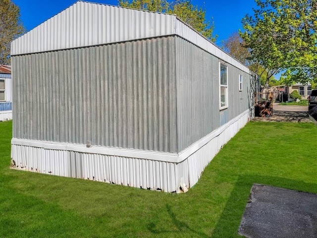 411 S Grover Ave, Alma, MI 48801 - view of home's exterior featuring a lawn