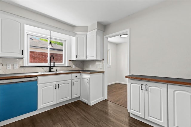 kitchen with a sink, dishwashing machine, dark wood-style floors, and white cabinets