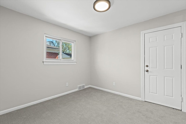 empty room with carpet floors and baseboards