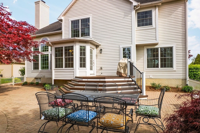 1433 Bicentennial Pkwy, Ann Arbor, MI 48108 - rear view of house with a patio, fence, a chimney, and a shingled roof