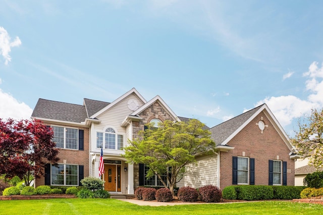 1433 Bicentennial Pkwy, Ann Arbor, MI 48108 - traditional-style home with brick siding and a front lawn