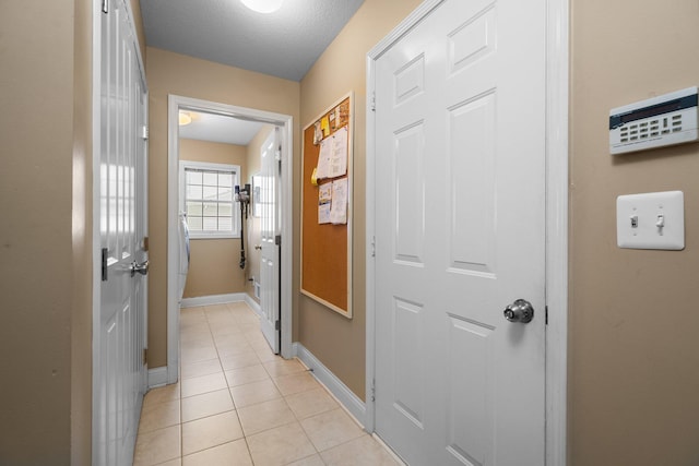 1433 Bicentennial Pkwy, Ann Arbor, MI 48108 - hallway with light tile patterned floors and baseboards